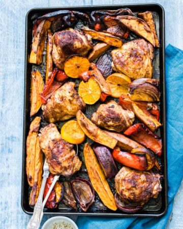 Close up of Sheet pan Chicken Thighs and Sweet Potato dinner on a table