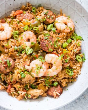overhead view of instant pot jambalaya with shrimp on top served in a white bowl