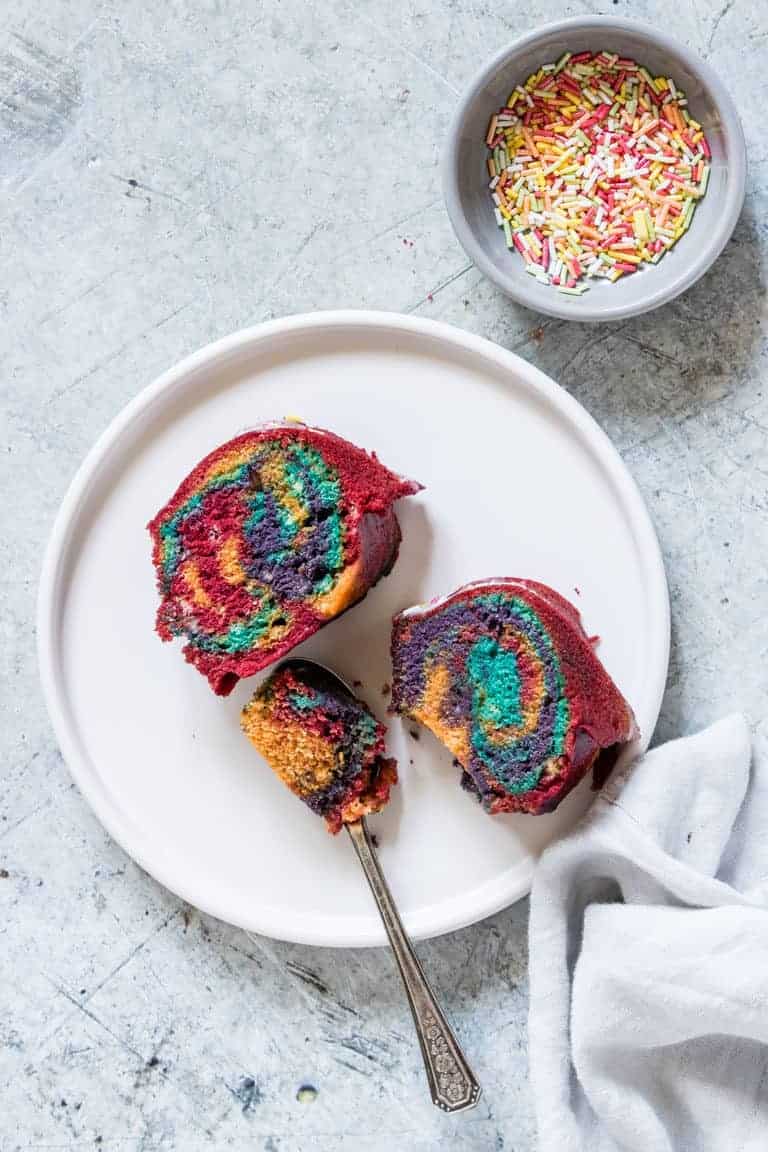 2 slices of pressure cooker cake on a plate with sprinkles