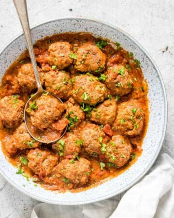 a blue dish filled with instant pot meatballs