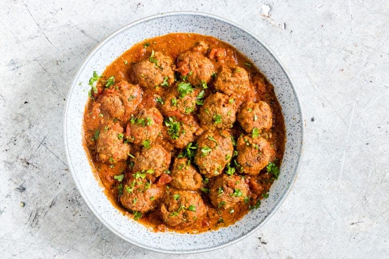 close up of pressure cooker meatballs in a bowl