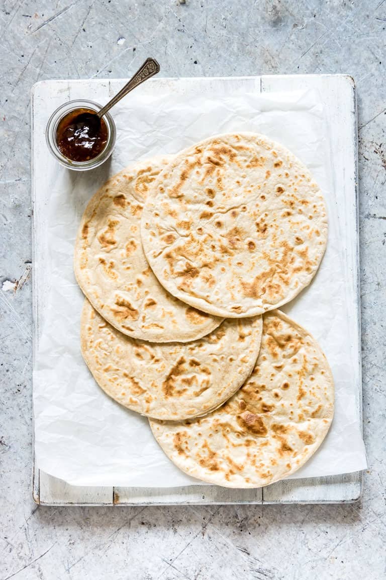 rotis on a board with chilli