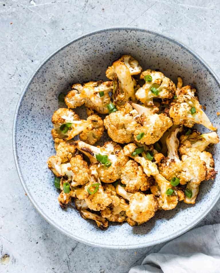 close up of air fryer cauliflower wings in a bowl