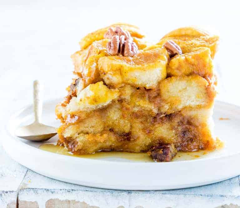 closeup of a bowl of slow cooker bread pudding with pumpkin