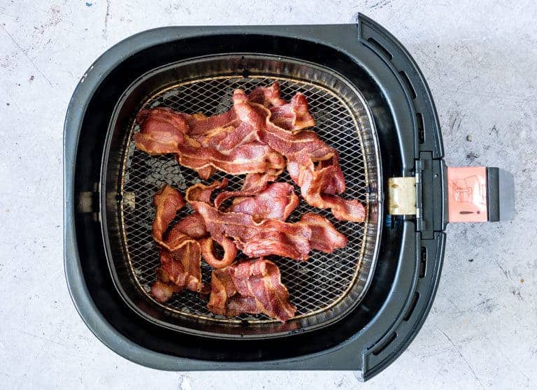 Photo of cooked bacon in air fryer after following the Air Fryer Crispy Bacon recipe