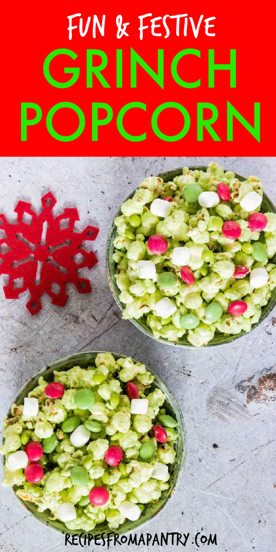 two bowls of green popcorn mixed with marshmallows and red candies