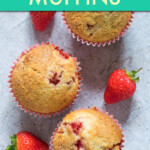 three muffins with strawberries in between them.