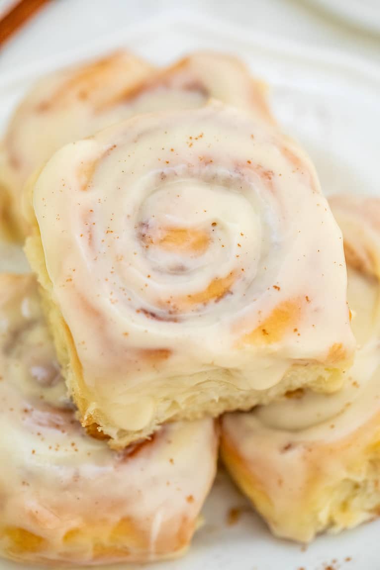 Close up view of a plate filled with finished Pressure Cooker Cinnamon Rolls.
