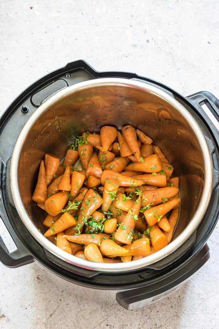 cooked Instant Pot Carrots topped with parsley and ready to serve