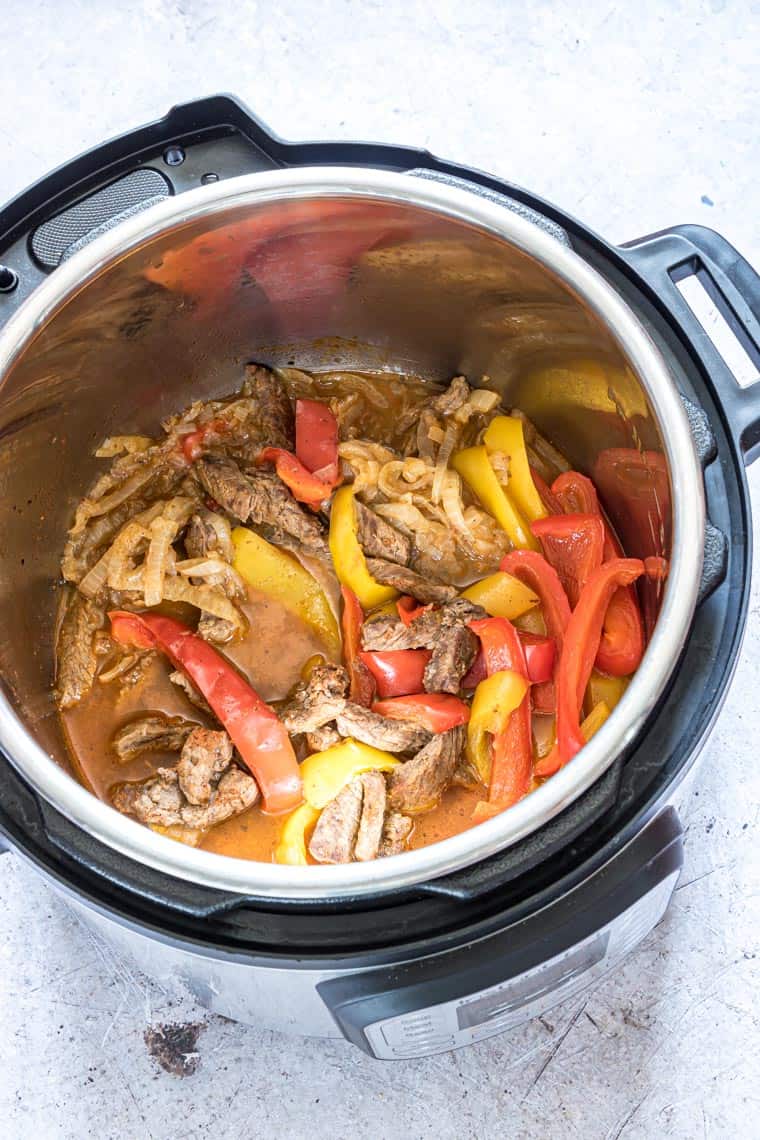top down view of the cooked instant pot steak fajitas in the instant pot