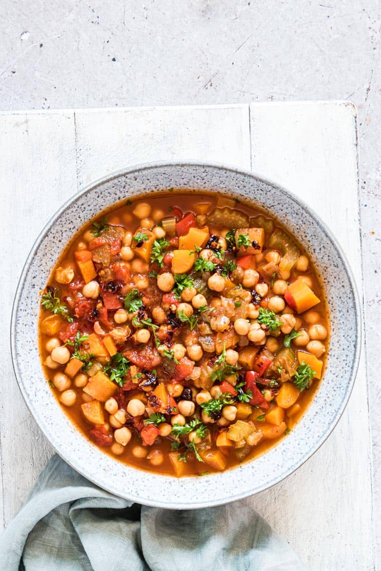 close up view of instant pot chickpea stew in a ceramic bowl