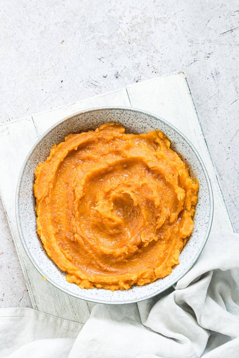 close up of mashed sweet potatoes in a bowl