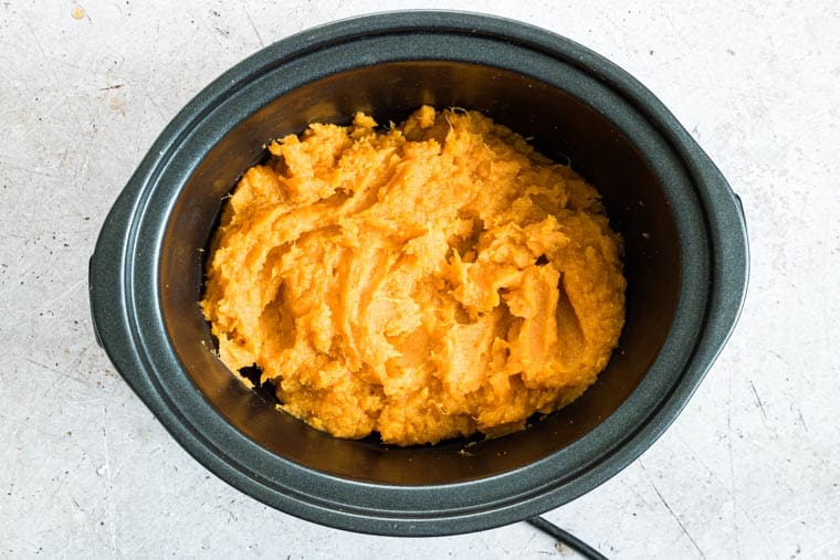 mashed sweet potatoes inside the slow cooker