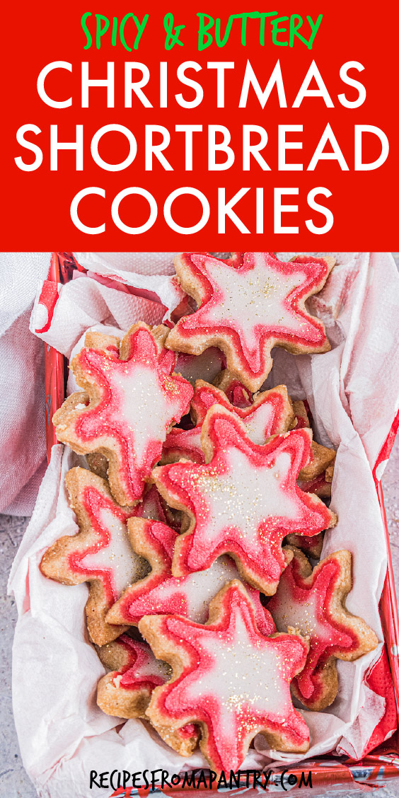 a bunch of star-shaped shortbread cookies in a box with white tissue paper