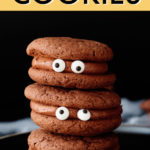 a vertical stack of 3 chocolate cookies with candy eyes