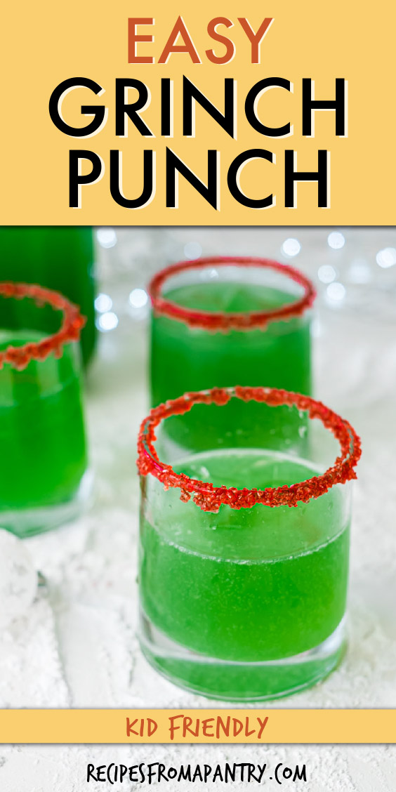 several glasses of green grinch punch with red sugar around the rim