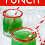 two glasses of grinch punch with red and white striped straws