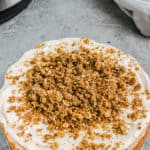 A round cheesecake with crumb topping
