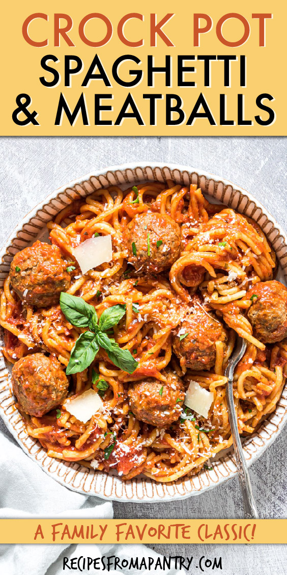 close up of pasta and meatballs with cheese on a plate