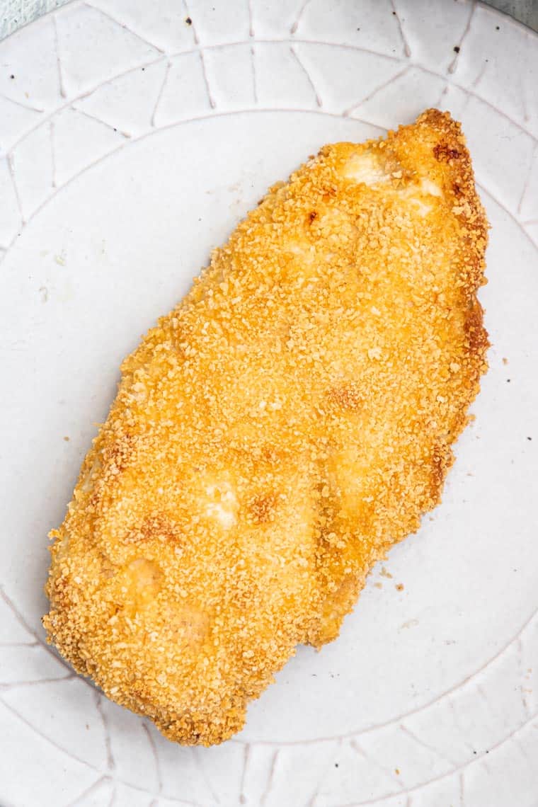 close up view of a piece of breaded chicken