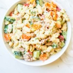 close up of creamy tuna pasta salad with vegetables