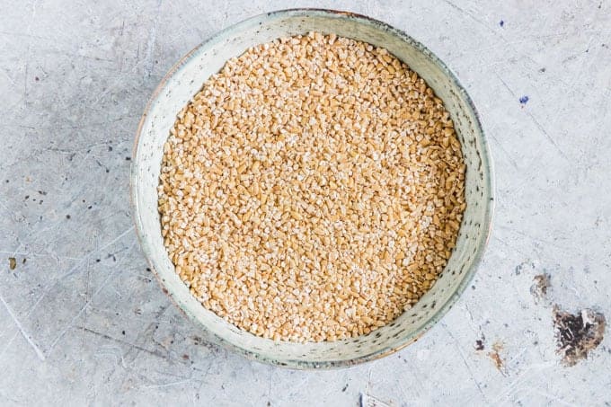 bowl containing steel cut oats on counter to be used in instant pot steel cut oats