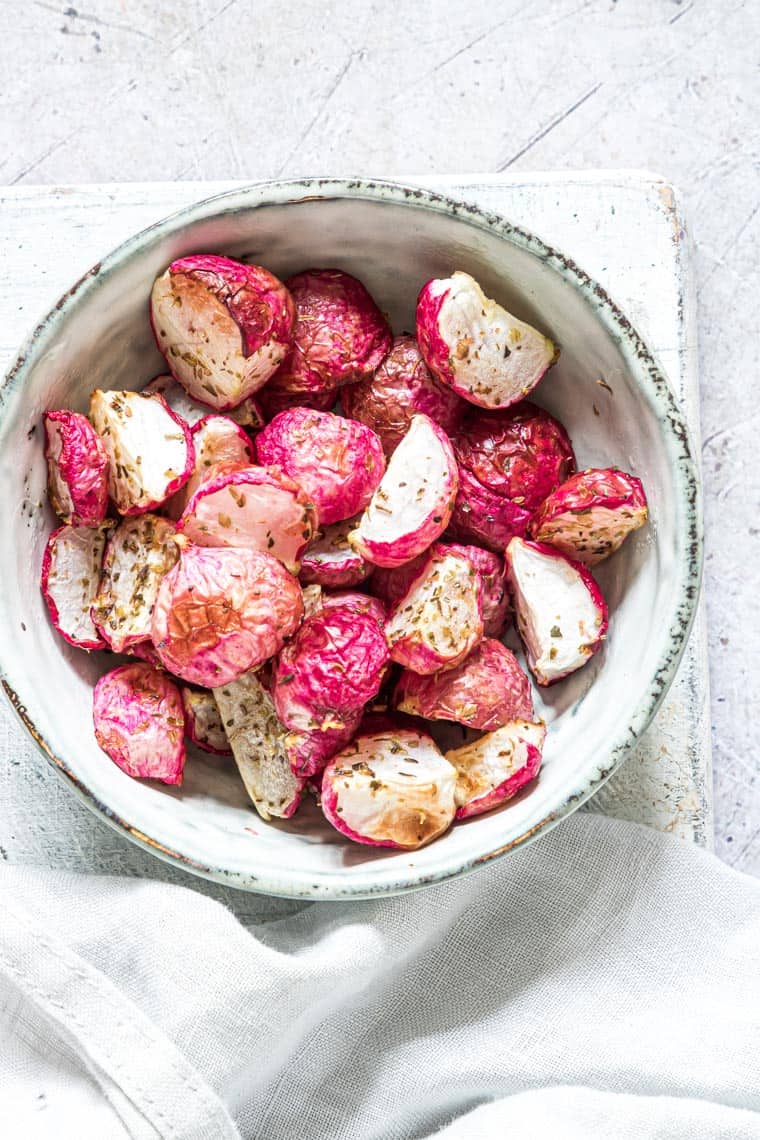 air fryer fried radishes served in a blue bowl