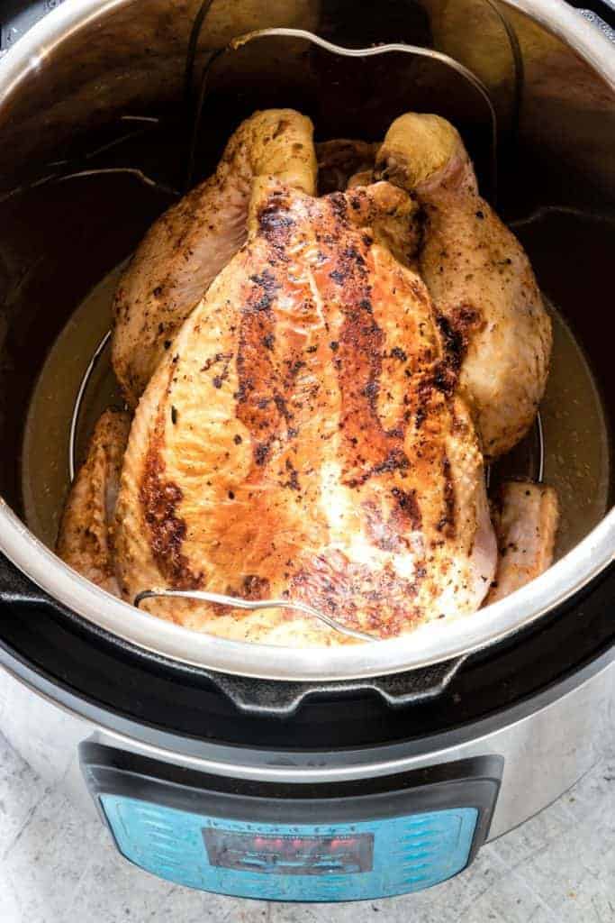 Learn how to EASILY cook a whole chicken in the Instant Pot in less than 45 mins. This is a simple and easy-to-follow Instant Pot recipe that can be modified to suit your needs. Paleo, Keto, and Whole 30 diet friendly. #instantpot #instantpotrecipes #instantpotwholechicken #pressurecookerwholechicken