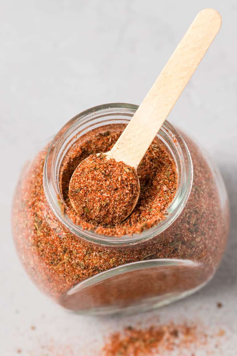top down view of a storage jar containing creole seasoning