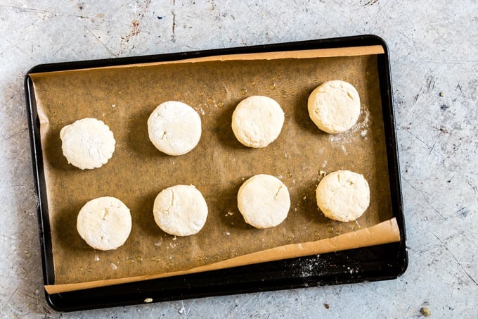 eight lemonade scones on a baking tray waiting to be baked