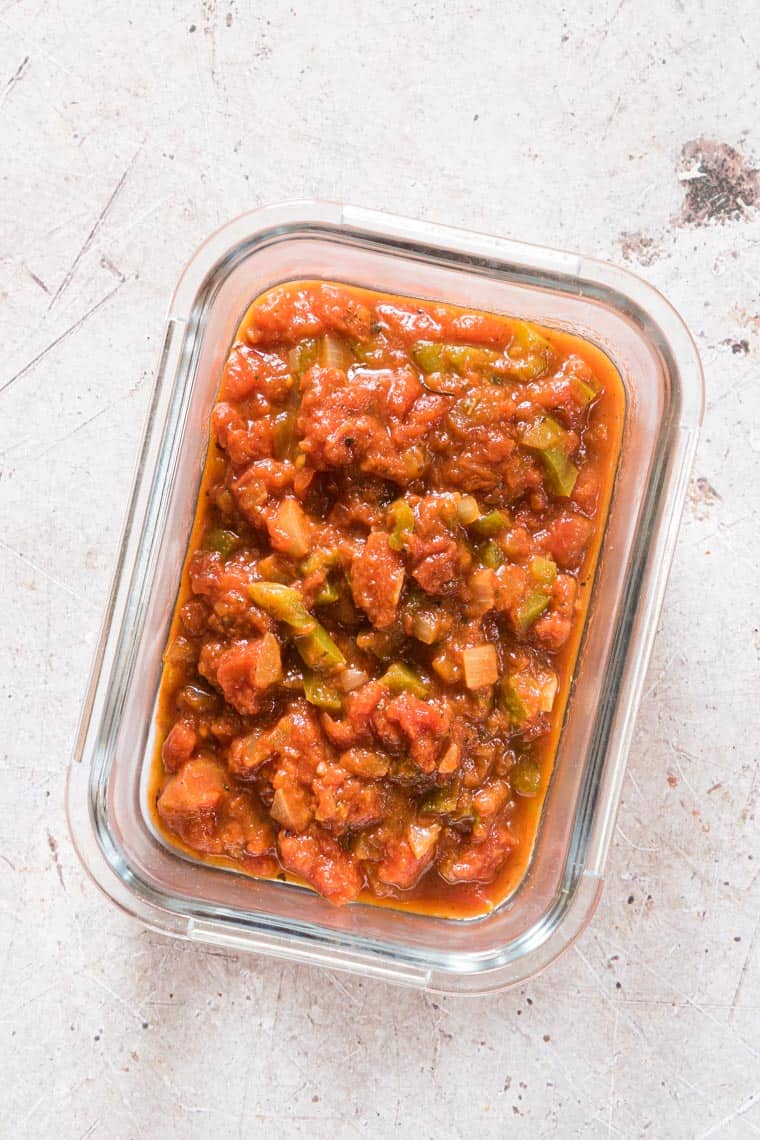 glass meal prep container filled with creole sauce