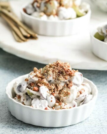 a serving of southern grape salad in a white ceramic dish
