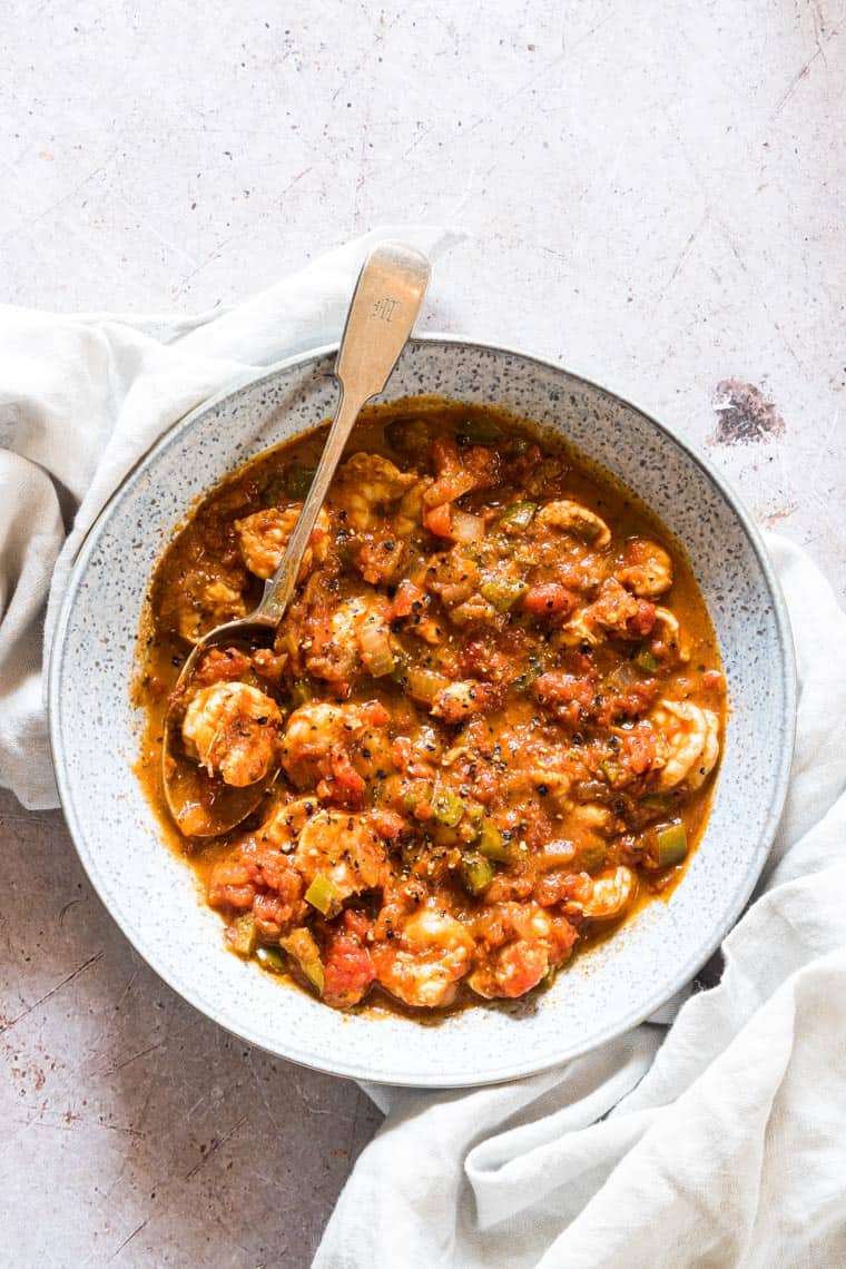 shrimp creole served in a bowl with a spoon