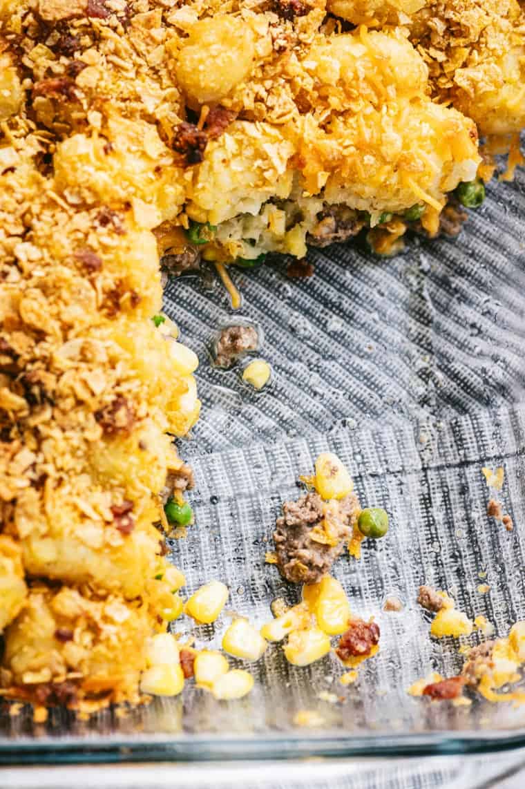 close up view of tater tot casserole with portions removed