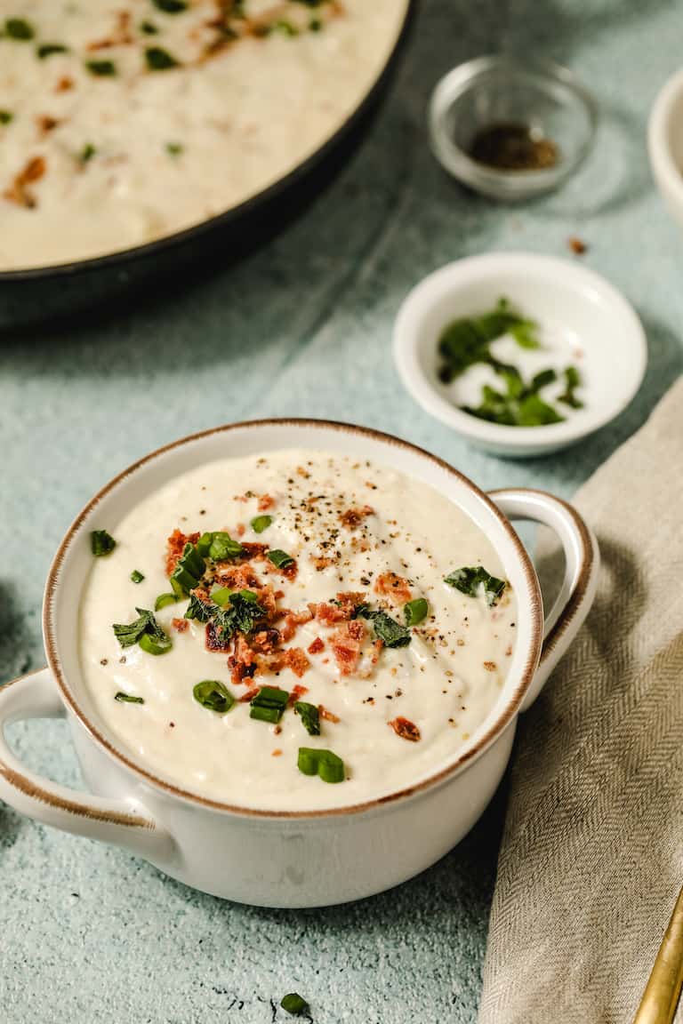 a cup of instant pot clam chowder ready to be served