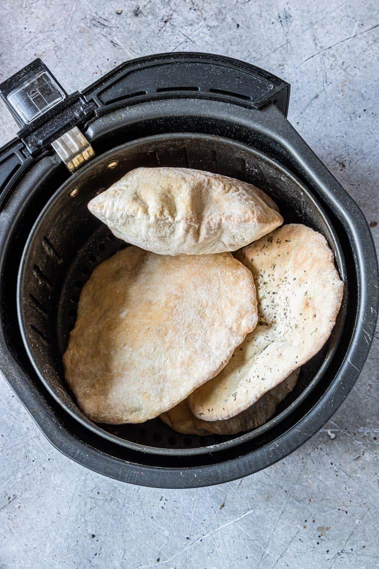 cooked flatbread inside the air fryer basket