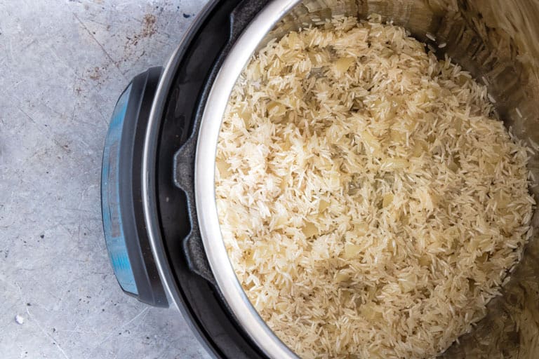 instant pot containing cooked instant pot rice with lid off
