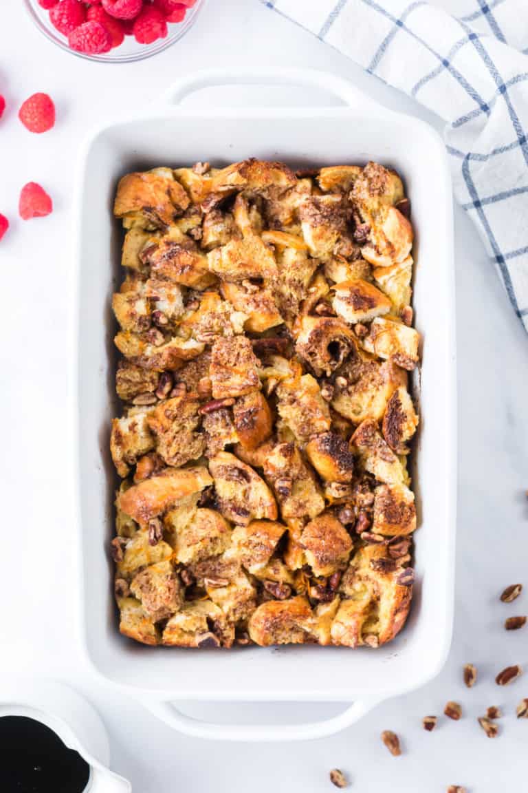 A baking dish full of golden baked french toast casserole
