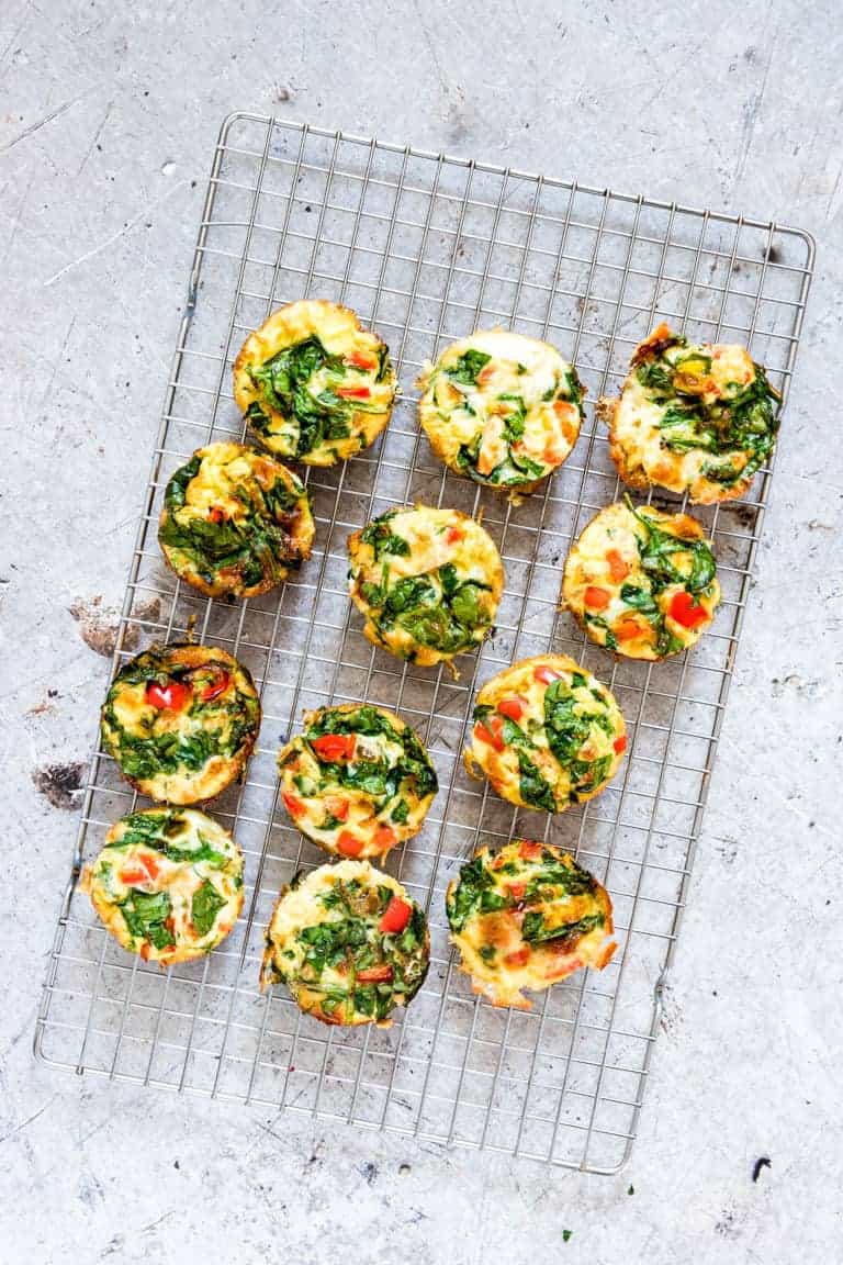 egg muffins cooling on a wire rack on countertop