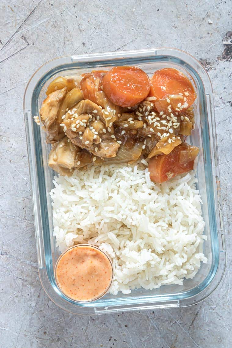 glass meal prep container filled with hibachi chicken and rice