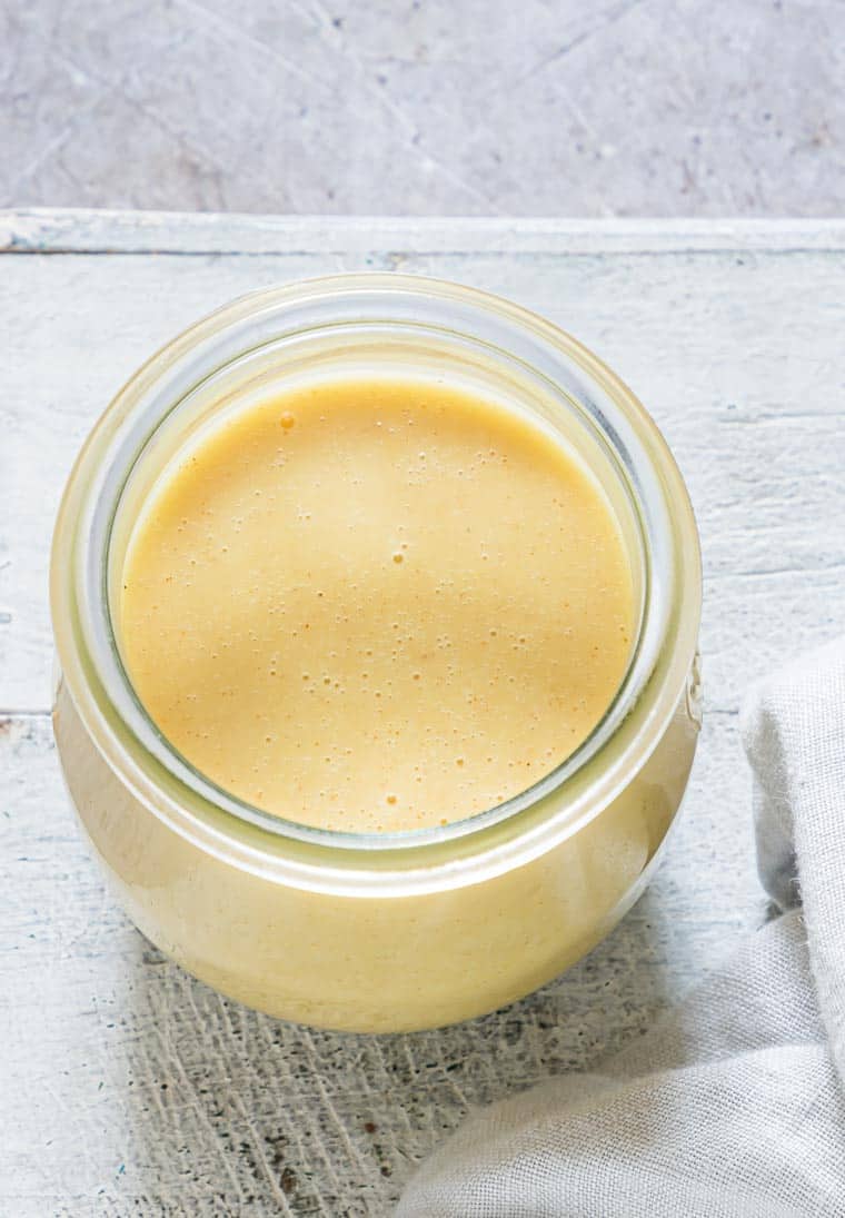 top down view of honey mustard sauce in a glass jar