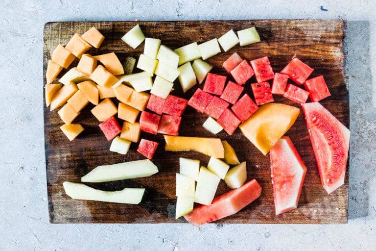 slices of melon on a cutting board