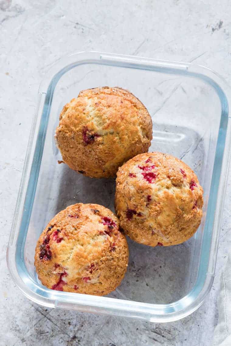 3 fresh air fryer muffins with raspberries in a lunch box