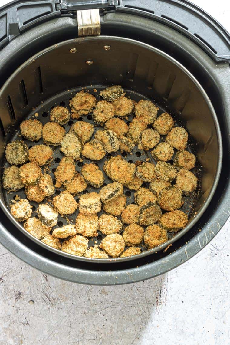 cooked air fryer fried pickles inside the air fryer basket