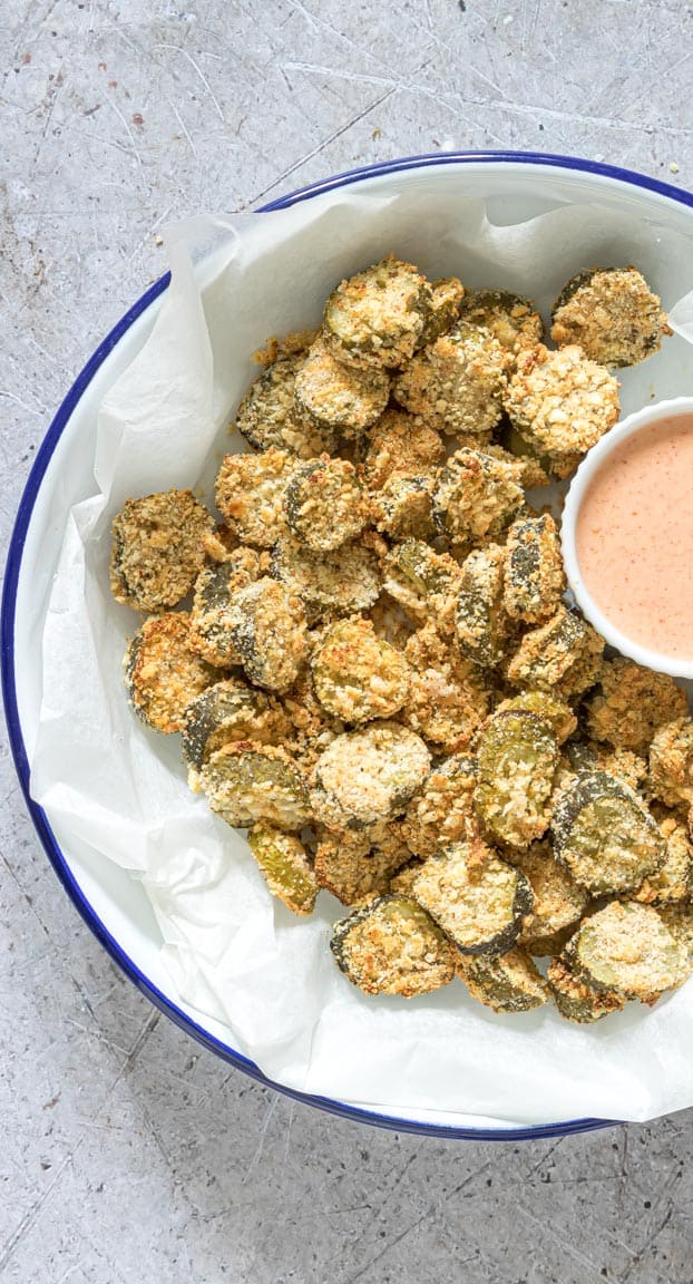 close up of air fryer fried pickles served with a dipping sauce