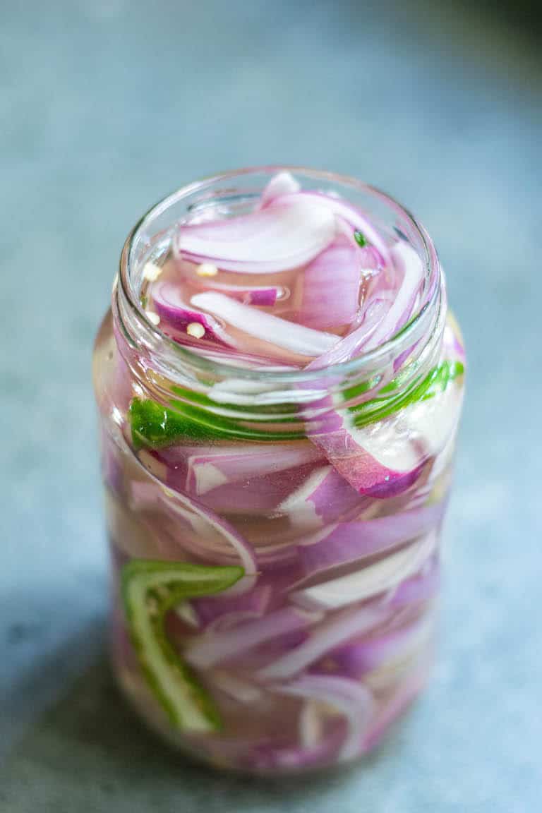 a jar containing pickled onions