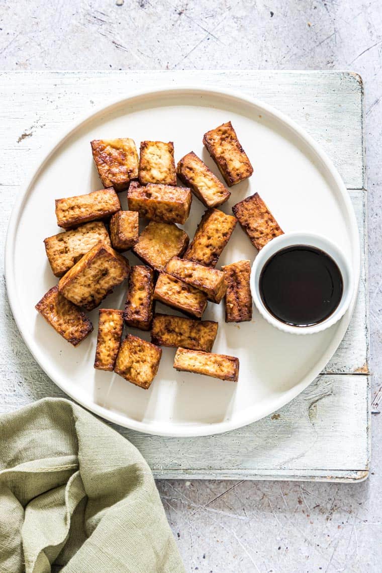 completed air fryer tofu served on a white plate