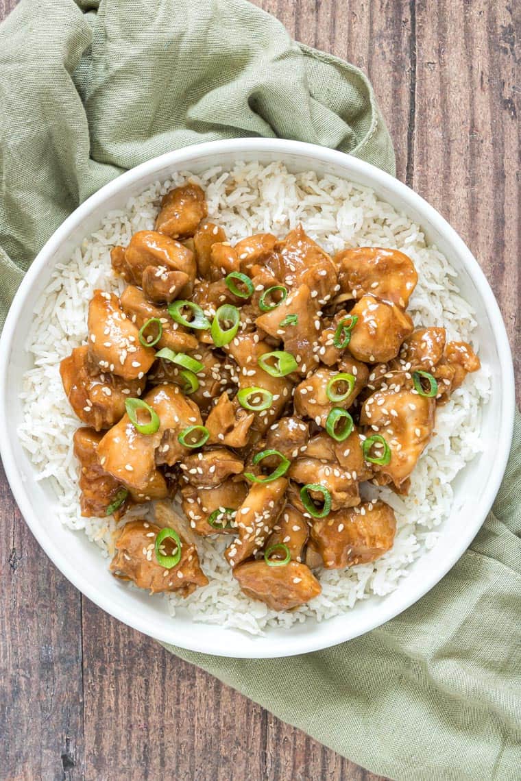 instant pot sesame chicken served in a white bowl over rice