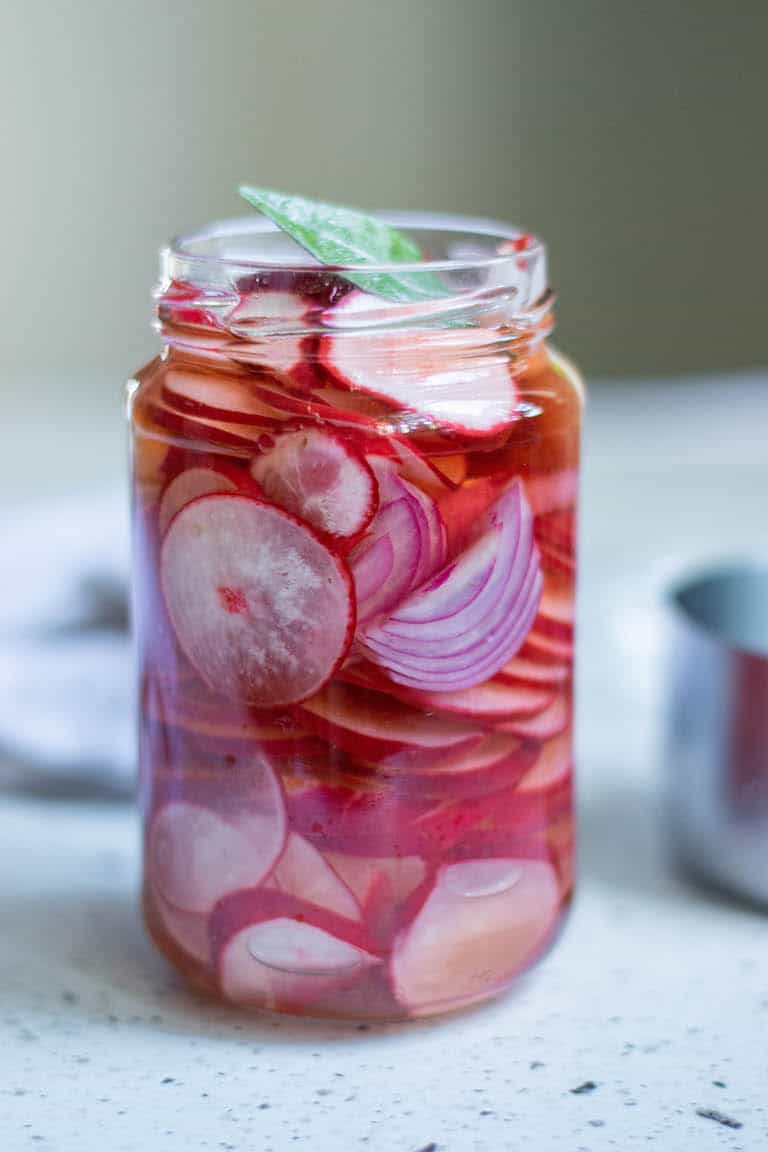 pickled radishes in a glass jar