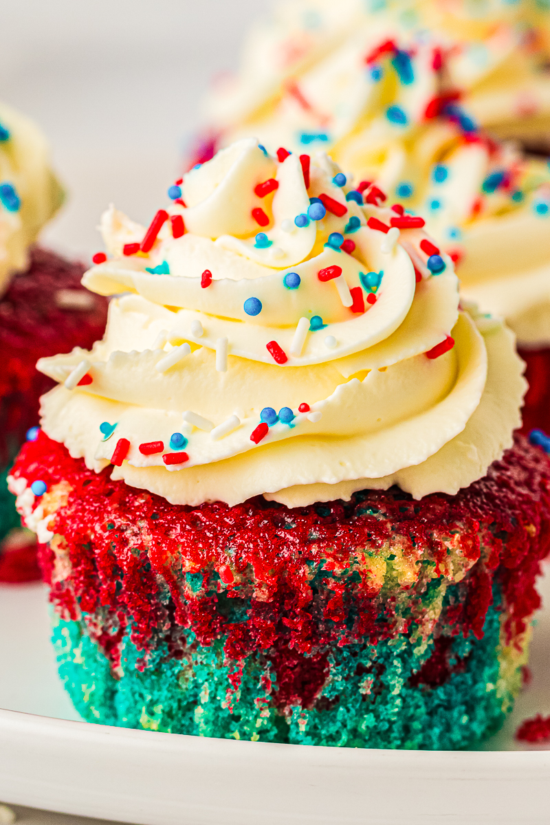 4th of July cupcakes on a wood surface.